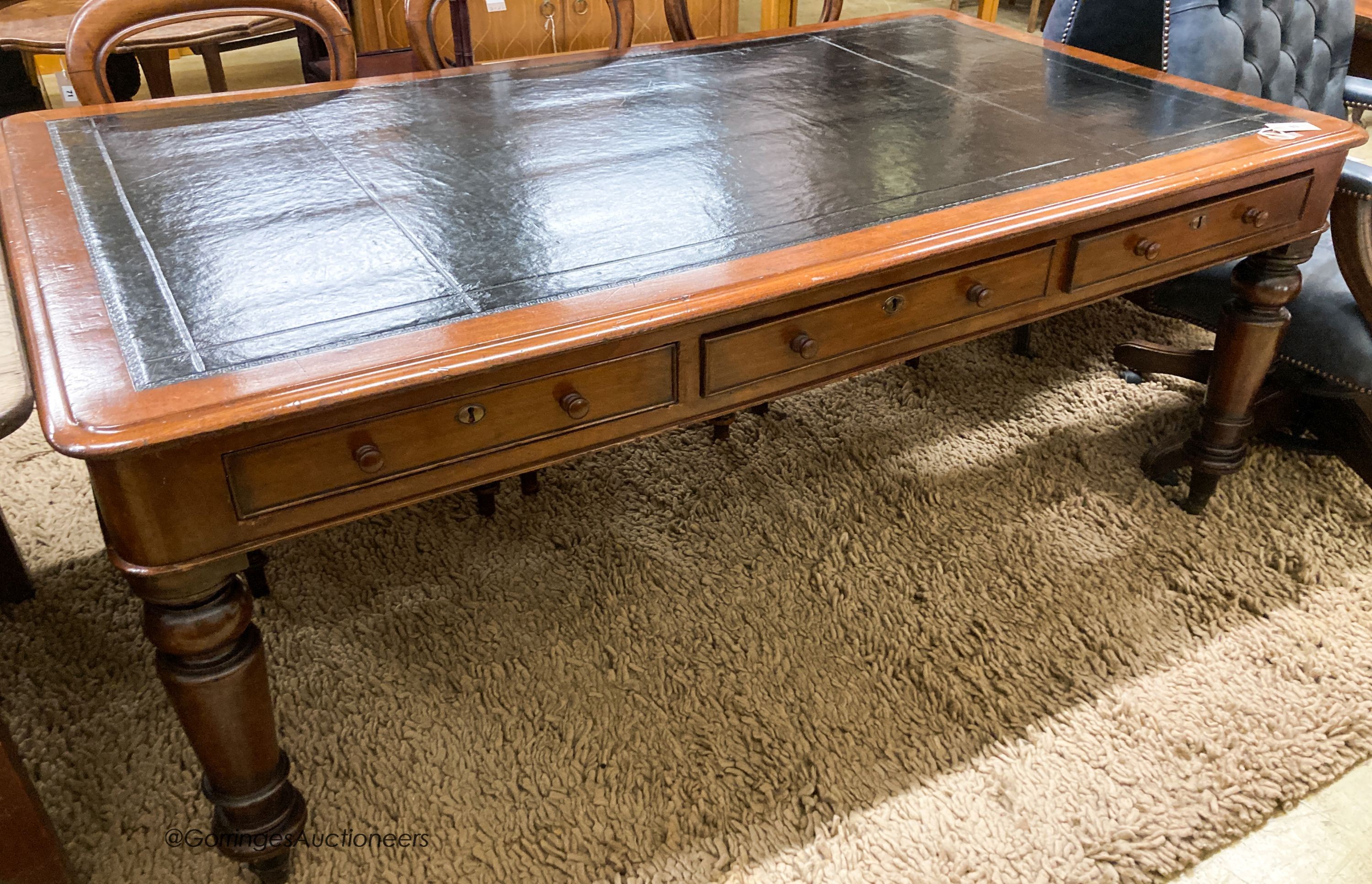 A Victorian mahogany partner's writing table with black leather inset top, length 180cm, depth 102cm, height 72cm